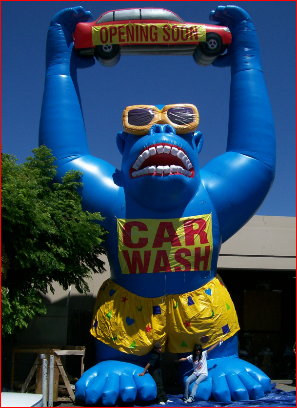Blue Inflatable Gorilla with Car for Car Wash Opening - Custom Inflatables Gallery Image